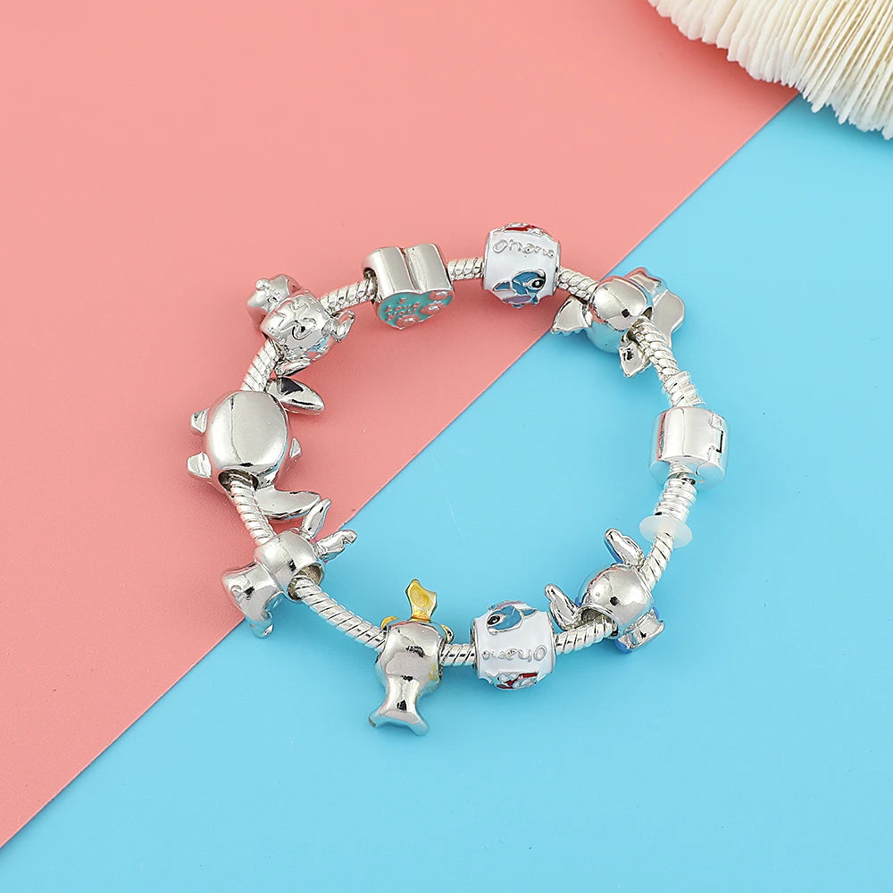 ✨ Bracciale Lilo & Stitch - Charm in Metallo, Perle Colorate, Regalo Magico per Donne e Bambine!
Ispirato al cartoon hawaiano, perfetto per appassionate e collezioniste